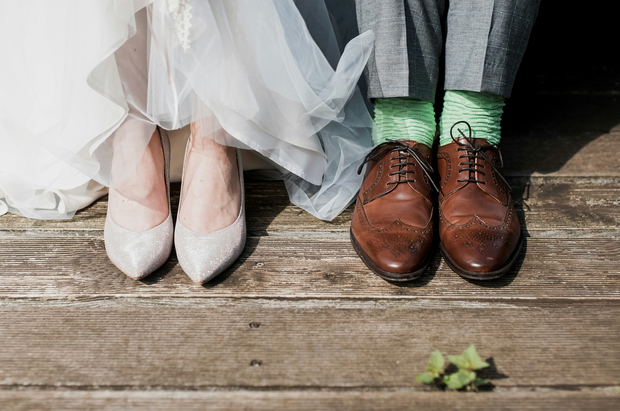 Bride and groom's shoes next to each other