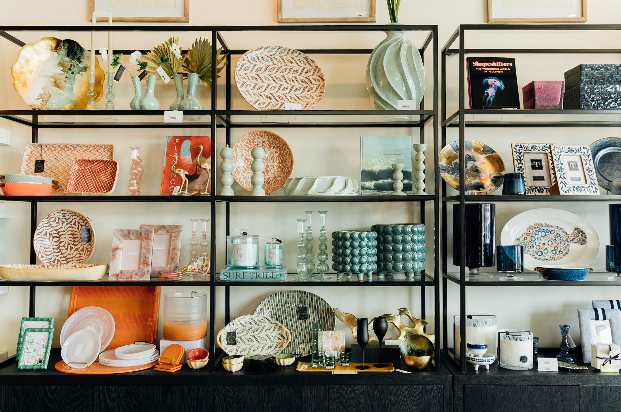 Collection of home gifts and decor on shelving at Black Tie Beach Shop